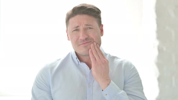 Portrait of Sick Man having Toothache