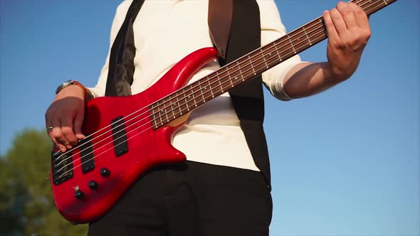 Man Playing Bass Guitar Outdoor