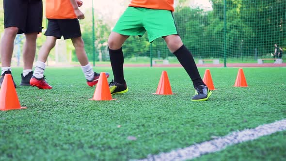 Boy in Football Uniform Performing Speedy Exercises During Training Day on the Outdoors Sport Field