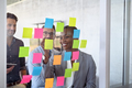 Business people using post it notes to share ideas - PhotoDune Item for Sale