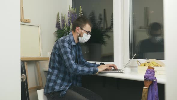 Man freelancer working on remote project at home studio on balcony. Working from home concept