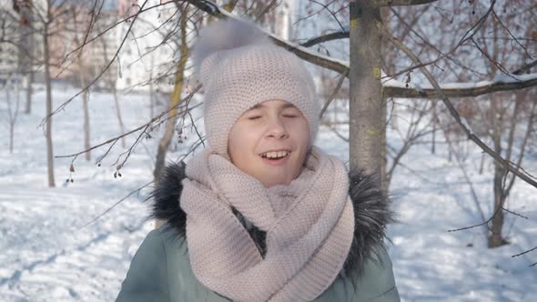 Child in Leafless Forest in Winter