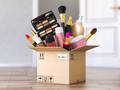 Cardboard box with cosmetics product in front od open door.  - PhotoDune Item for Sale