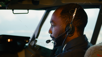 African american copilot taking off with airplane captain