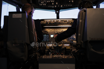 Team of captain and copilot throttling engine to fly airplane