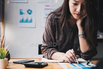 e on wooden desk in office and business working background, tax, accounting, statistics and analytic research concept