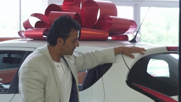 Happy Handsome Mature Man Showing Thumbs Up After Buying a Car