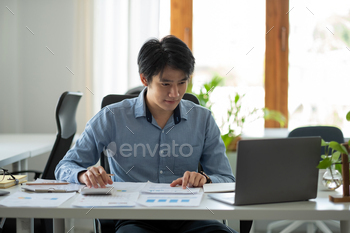 n wooden desk in office and business working background, tax, accounting, statistics and analytic research concept.