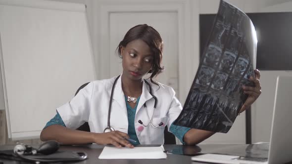 Beautiful African American Healthcare Worker with X-ray, Medical International Concept, Black Doctor