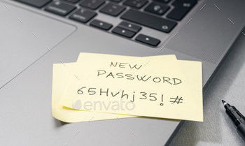 ticky note on laptop. Computer security management concept