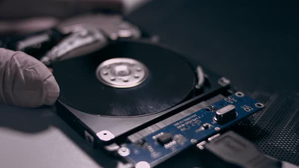 Macro Close Up of Working Opened Hdd Drive Hard Disk, Move of Writing, Reading Magnetic Head