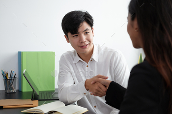 ger and acquisition,successful negotiate,hand shake,two businessman shake hand with partner to celebration partnership and business deal concept.