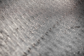 in silver or grey tone. Selective focus at center with blur edges of image.