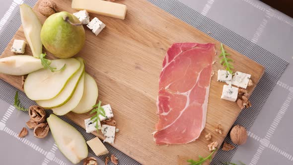 Making Pear and Blue Cheese Salad  Slices of Jamon