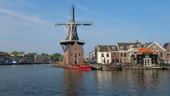 Harlem Landmark Windmill De Adriaan on Spaarne River. Harlem, Netherlands