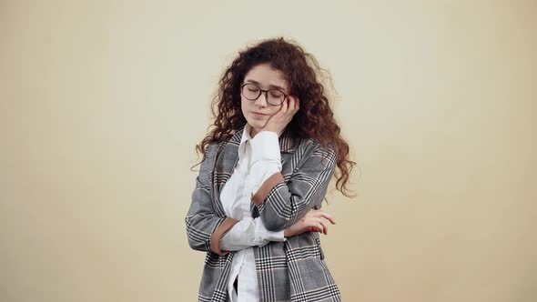 Sad Young Woman with Her Chin on Her Chin is Breathing Hard Bored