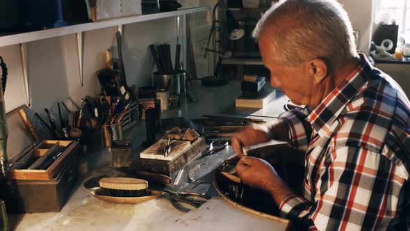 Goldsmith working in workshop