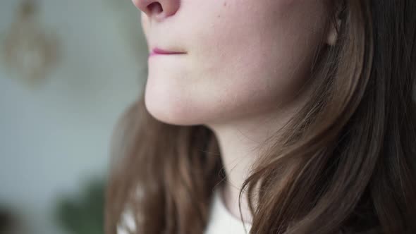 A Woman Paints Her Lips Closeup