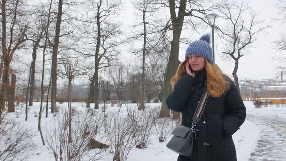 Woman Walks And Calling In The Park