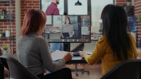 Asian Women Interviewing Candidate to Fill Job Vacancy on Video Call