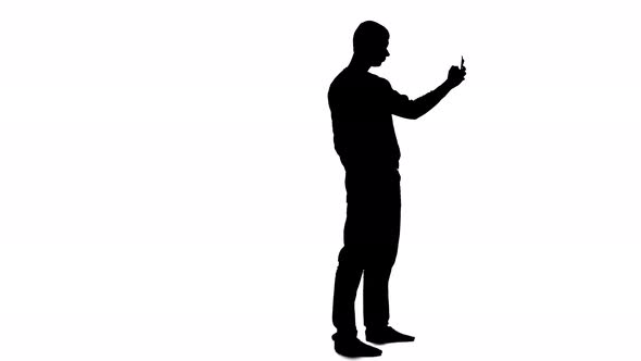 Man Makes Selfi. White Background. Silhouette