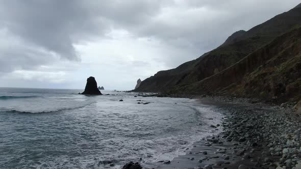 Drone flying low over Benijo beach in Tenerife, Canary Islands, Spain