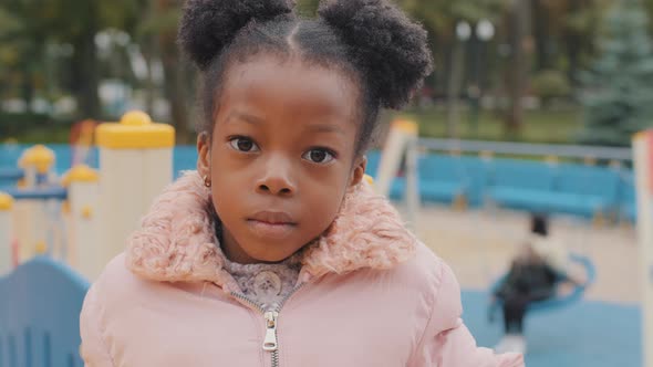 Serious Portrait Cute Little Afro American Kid No Emotion Closeup Alone Small Girl Looking at Camera