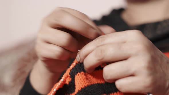 Close up of knit work tie-up hand work. 4k Close up footage of process of knitting