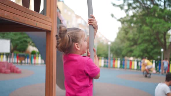 Child Playing on Playground Warm Summer Day
