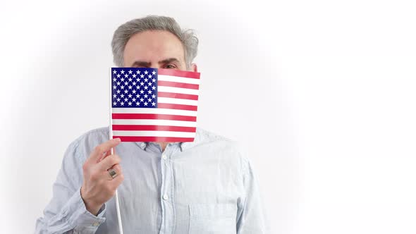 40s Caucasian Man Hiding Behing the US Flag  Portrait Isolated on White Background