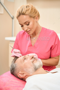 ce of male patient in beauty salon. Cropped photo