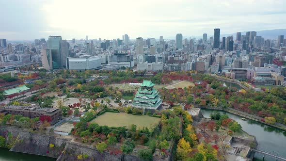 Aerial view 4k by drone of Osaka castle and building city at Osaka