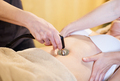 The osteopath applies a radiofrequency treatment to the abdomen. - PhotoDune Item for Sale