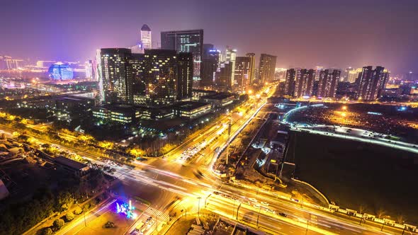 Timelapse of busy traffic road with modern office building in hangzhou china