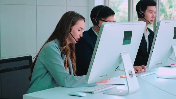 Business People Wearing Headset Working in Office