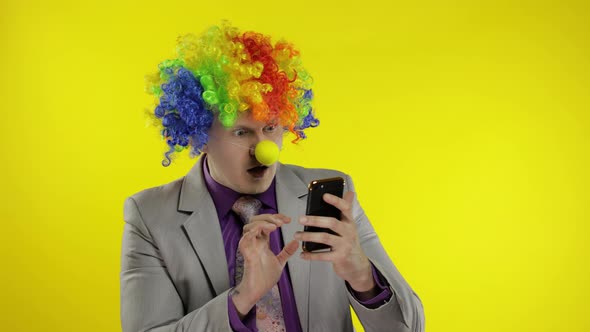 Clown Businessman Entrepreneur Boss in Wig Losing at Work, Grabs Head. Problems