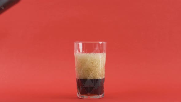 Coke bubbling in a glass.