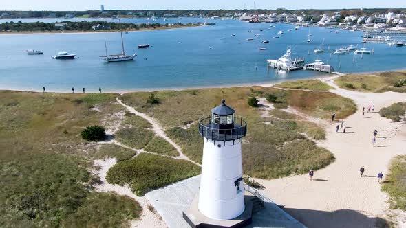 People At The Lighthouse Beach With Edgartown Harbor Light In Edgartown, Massachusetts, USA. aerial