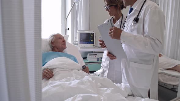 Doctors Visiting Senior Patient