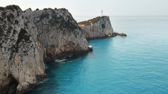 Aerial drone view of the Ionian Sea coast of Zakynthos, Greece. Rocky ridge with lighthouse