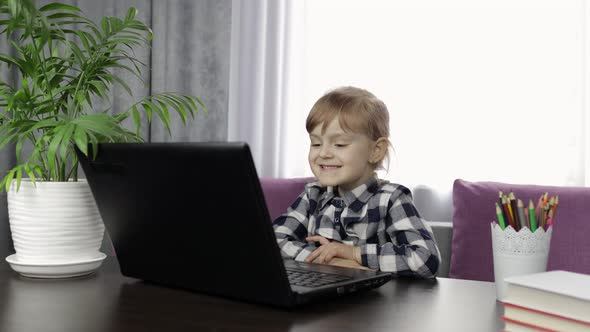 Girl Doing Online Homework Using Digital Tablet Computer. Distance Education