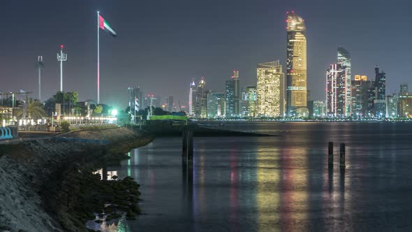 Panorama View of Abu Dhabi Skyline and Seafront at Night Timelapse United Arab Emirates