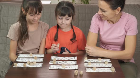Family with bingo game. 