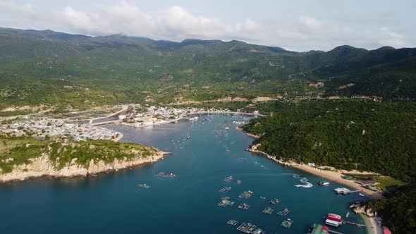 A breathtaking view over the waters of Vinh Hy bay in Vietnam. Countless boats moored near the sand