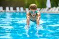 Boy in swimming goggles diving underwater - PhotoDune Item for Sale