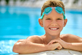 Boy with goggles smiling at camera in pool - PhotoDune Item for Sale