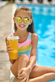 Girl with drink looking at camera near pool - PhotoDune Item for Sale