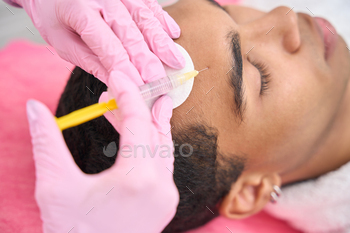 ent performed by experienced cosmetologist in nitrile gloves