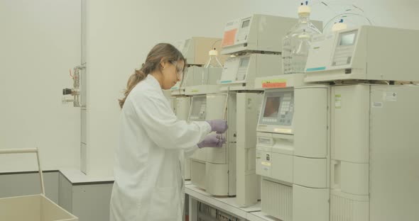 Scientist working with mass spectrometer in a pharmaceutical laboratory conducting experiments