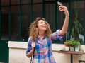 happy woman holding mobile phone taking selfie - PhotoDune Item for Sale